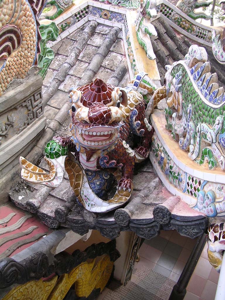A comical dragon in a rooftop corner