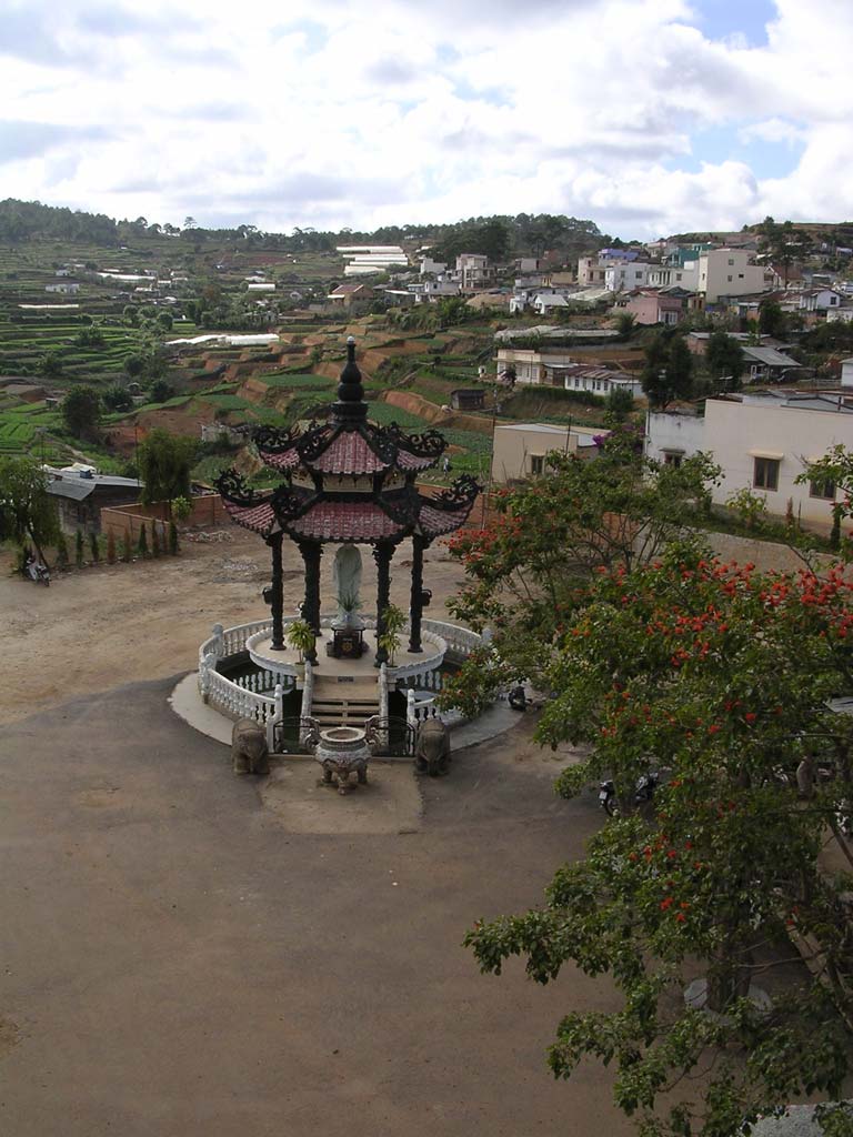 Looking down to the ornamental building in the yard