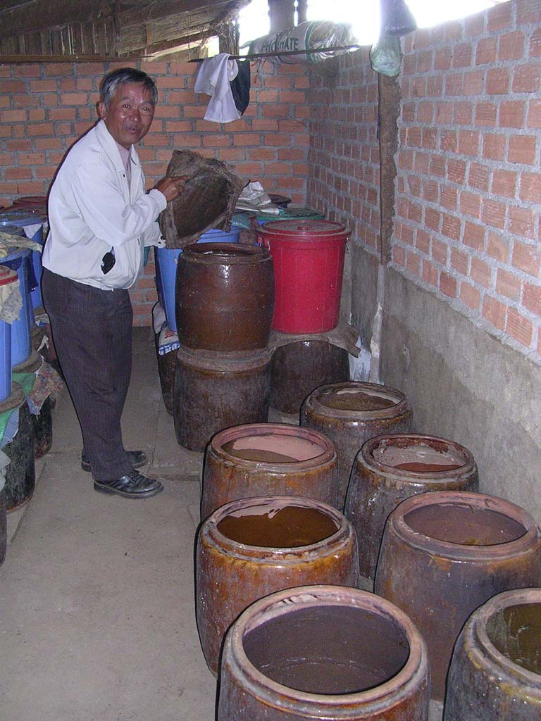 Ted shows us where they store the rice wine...