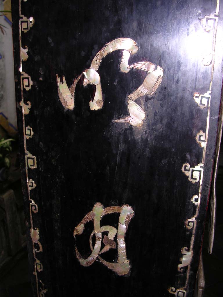 A panel of Chinese characters executed in mother of pearl in the form of flying birds
