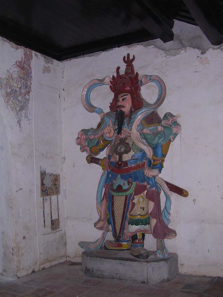 One of the guards on the gate (we're on the way back up river so it's darker now)