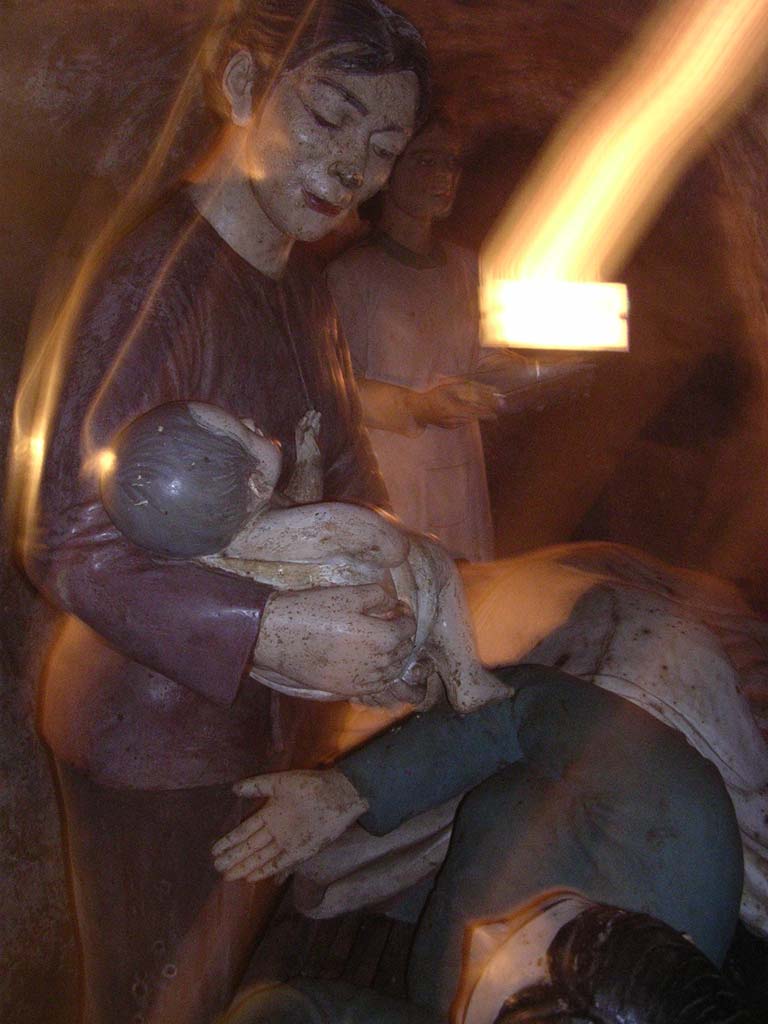 A mock-up in a side chamber, showing a new born baby