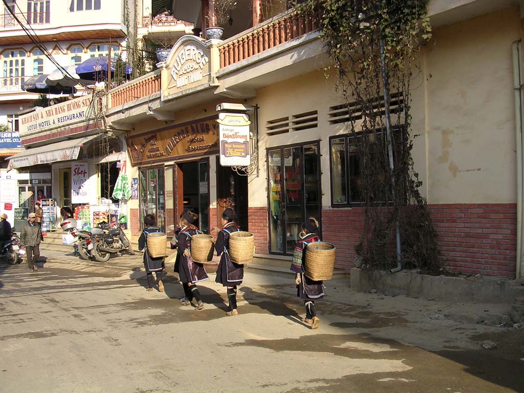 Black H'mong girls with their characteristic back-baskets