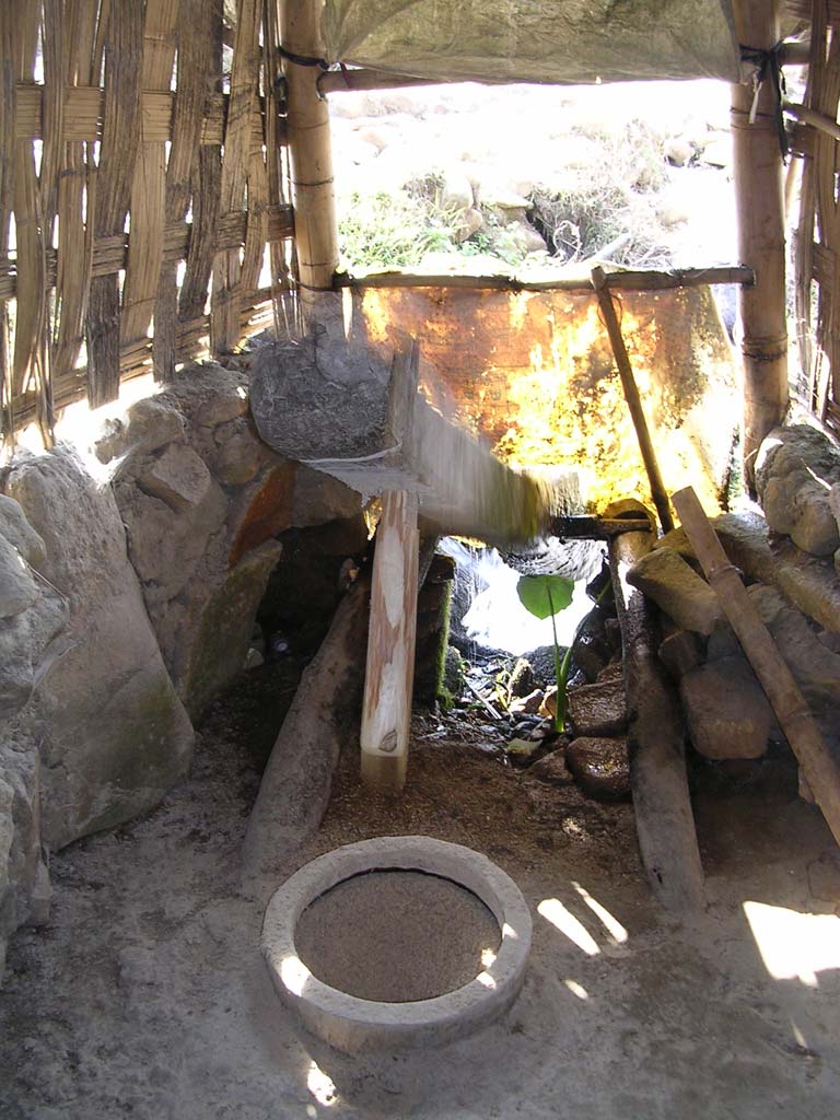 A water-powered rice mill in the up position...