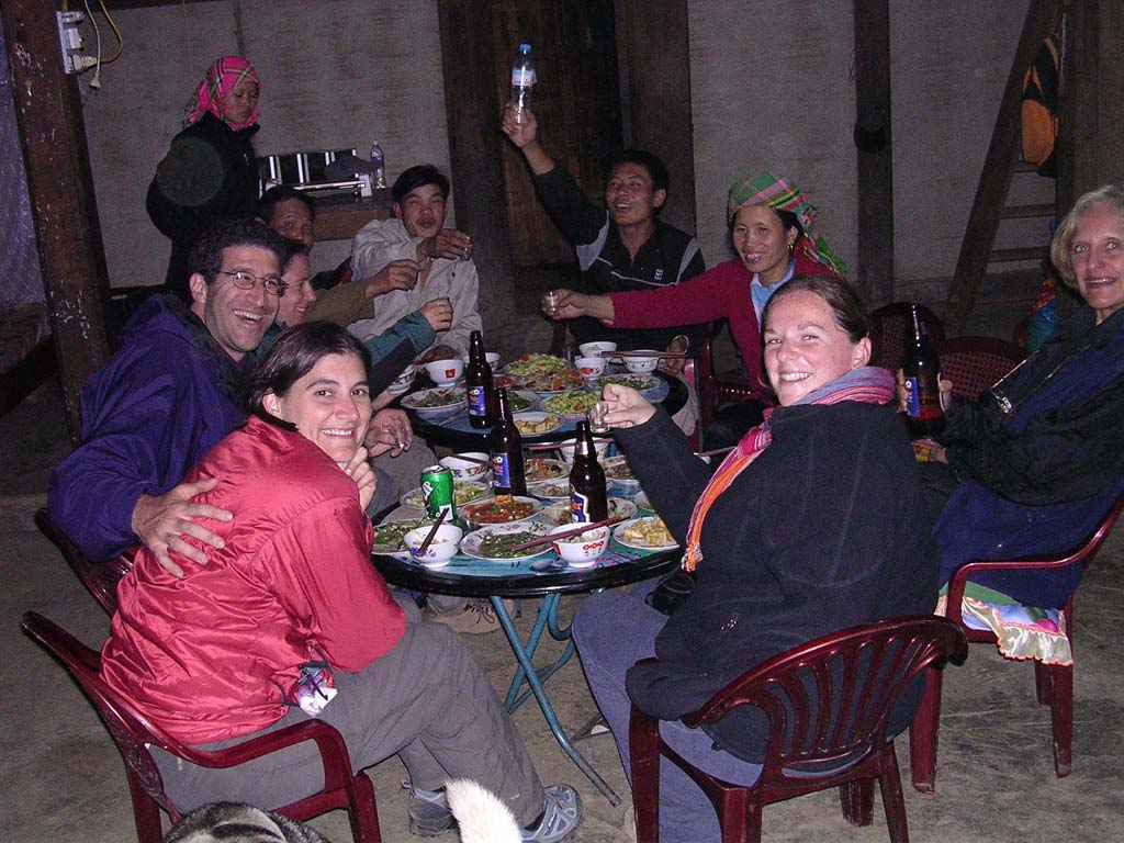 Dinner: Kate and Mark front left, Julie beyond Mark, Stephanie front right, our guide Luong holding up the bottle