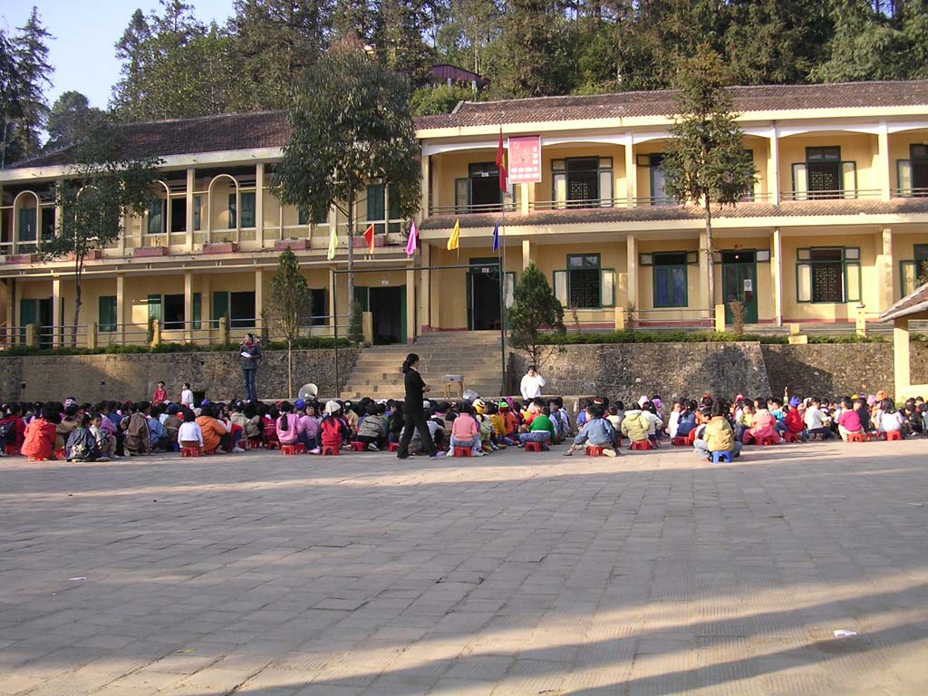 School assembly - note the woman behind the children...