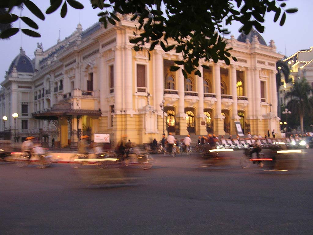Cyclos lined up outside the Opera, Hanoi