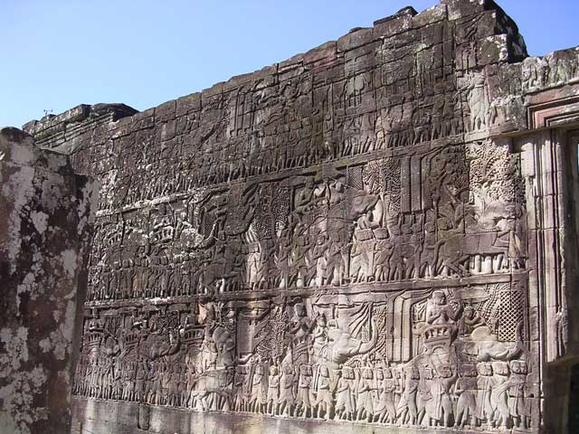 Three tiers: marching to battle on the bottom; carrying the coffins from the battlefield in the middle; Jayavarman VII in the top centre