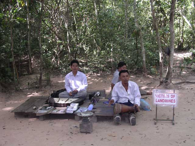 Band of land-mine victim buskers at Ta Prohm, Angkor, Cambodia