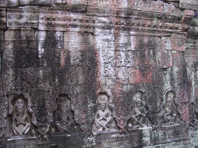 Hindu hermits (?) at the base of a wall