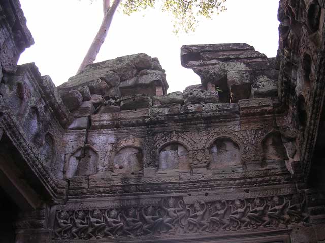 Frieze of <em>apsara</em> (angelic dancers) below the small arches