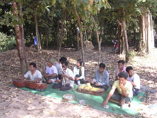 Band of land-mine victim buskers at Banteay Srei, Angkor, Cambodia. The guy at the front right is playing a leaf - and very accurately and piercingly!