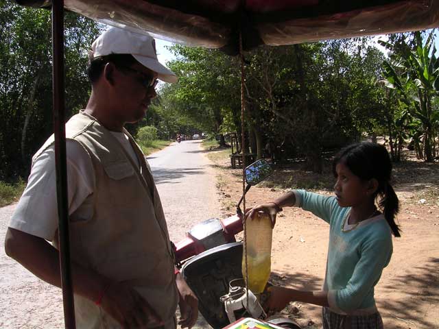 Topping up the tuk-tuk at Angkor