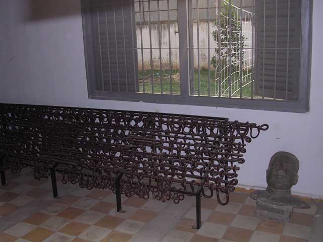 Shackles and a bust of Pol Pot