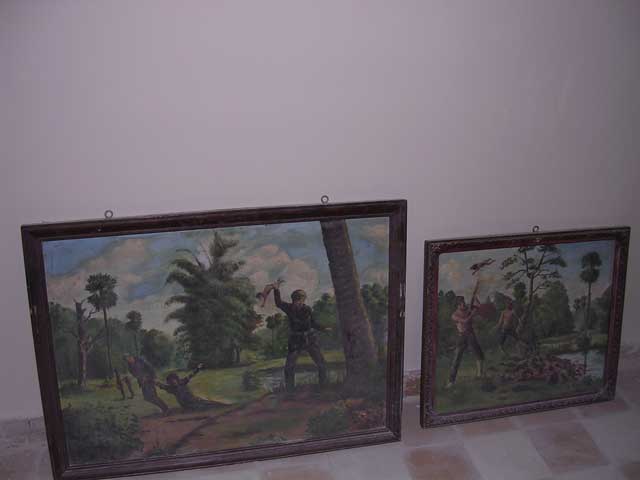 Two more paintings, showing how children were treated. See the Choeung Ek section for more on the tree in the left-hand painting.