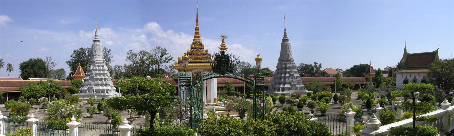 From the steps of the pagoda - from left to right: King Norodom's stupa, his equestrian statue, King Ang Duong's stupa, pavilion containing Buddha footprint<br />(composite of 3 photographs)