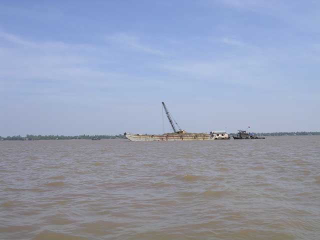 Our first sight in Vietnam: a dredger