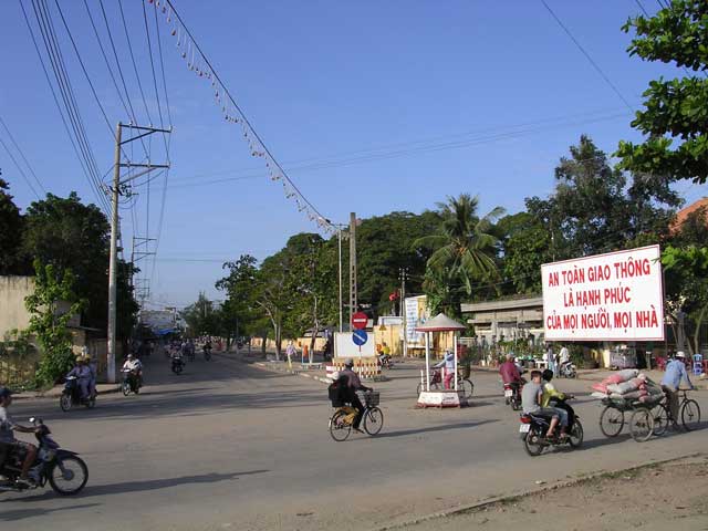 Chau Doc goes about its business - any translations of the sign?