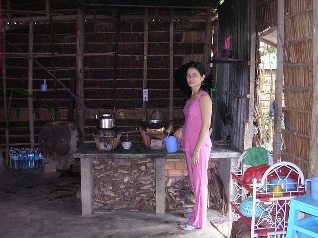 Hung's wife Mai in the kitchen