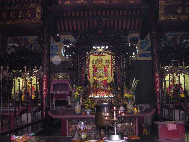 The main altar, with the symbolic weapons standing either side