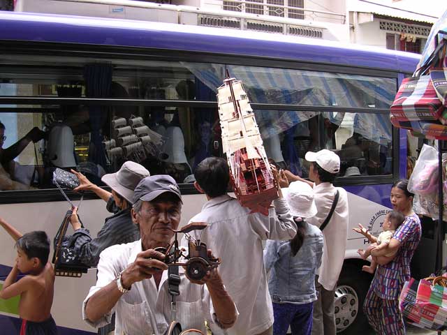 The scramble to sell us boats (etc.) outside the temple