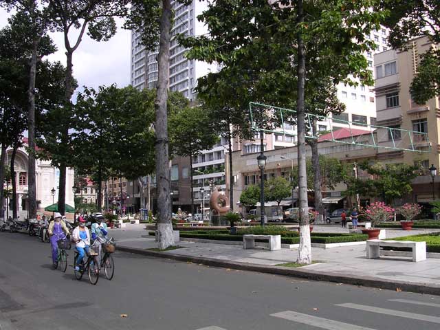 The same street with three women cycling