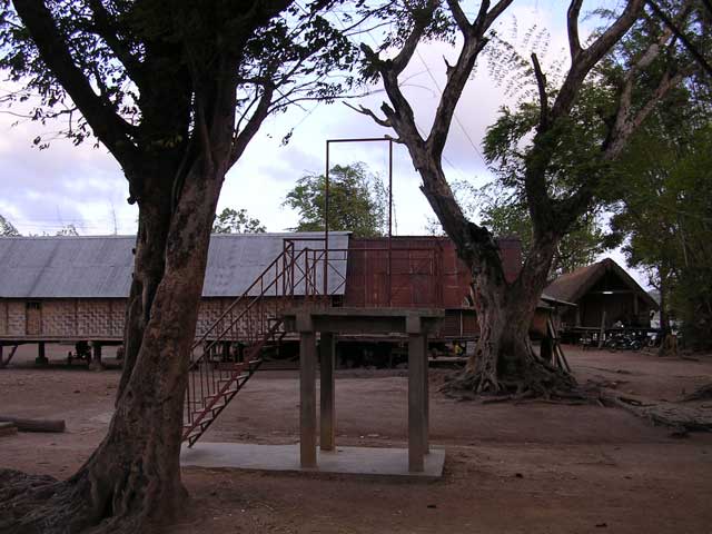 The platform - pulpit? in the middle of the village. What could it be for?