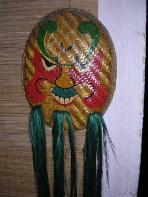 This Tet Festival mask, on the wall of a restaurant, bears an uncanny resemblance to someone we know.