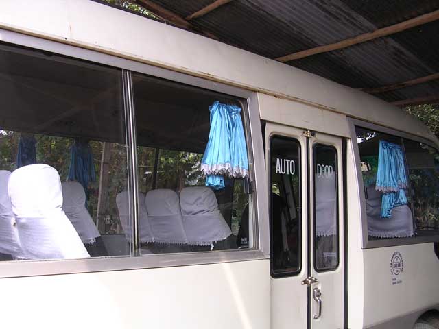 Very smart bus with fancy curtains at My Son, Vietnam