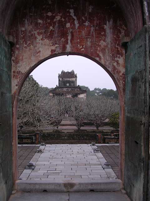 View of frangipani trees and the Stele Pavilion at Tu Duc's Tomb, near Hué, Vietnam