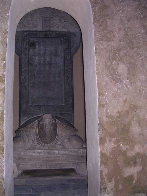 In a small pavilion, a gigantic stele set on the back of a marble turtle