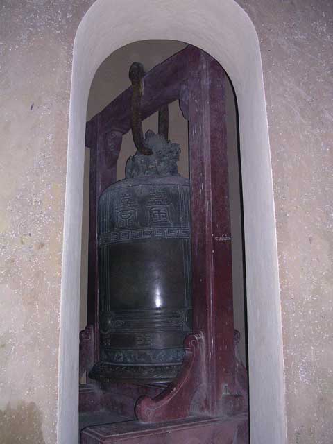 A matching pavilion contains this enormous bell