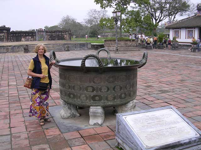 Mary with one of the Nine Dynastic Urns, symbolising the power of the Nguyen throne