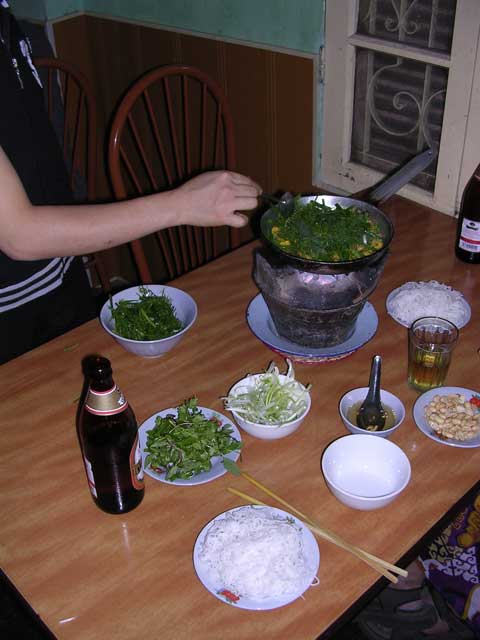 Cha Ca: fish, leaves, spring onions, etc. which all goes on cooking on the table - delicious!
