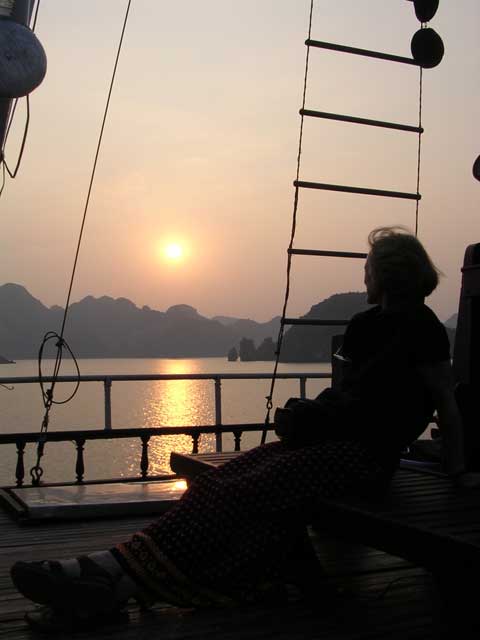 Mary enjoys the sunset in Ha Long Bay