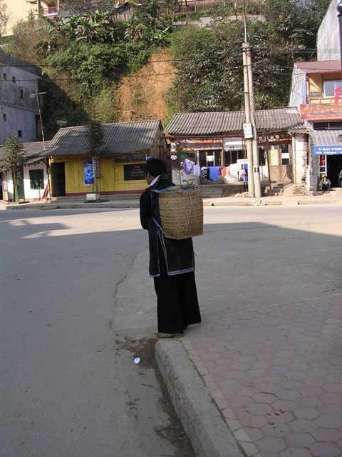 The H'mong men carry baskets too