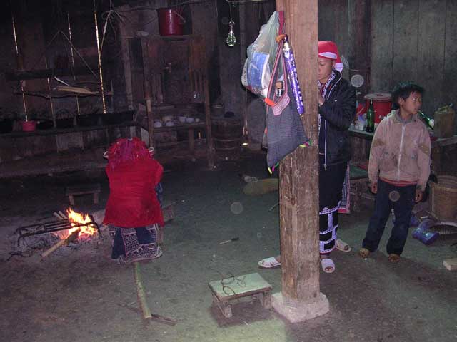 What a contrast between these Dao women's fine costumes and the conditions they live in