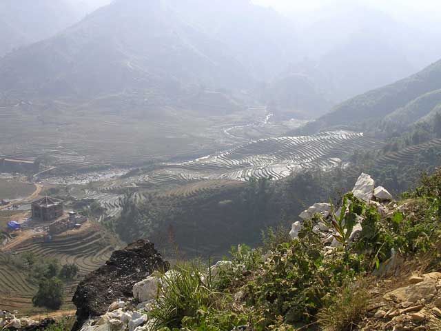 The backhoe is dropping the rocks over the edge here. And what a spot to be working in!