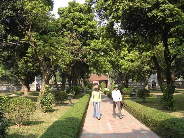 Two young local women on the path through the grounds