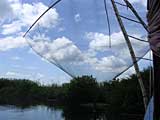 Another fishing rig, showing the basket into which the fish drop when the net is raised