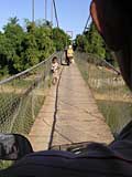 Crossing Stung Sangker on a decidedly iffy bridge (and the back of Han Houn's ear!)