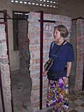 Mary by the cells, showing how small they were