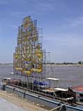 The last of the Festival floats. The change of direction occurs when the water from the swollen Mekong pushes back up towards the lake.