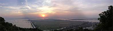 Panorama into the sunset over Cambodia
