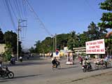 Chau Doc goes about its business - any translations of the sign?