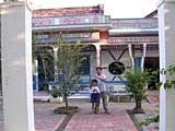 The homestay: our host, Hung and his son outside their house