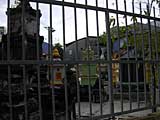 Tombs through the fence, showing a swastika, the 'circle of life'