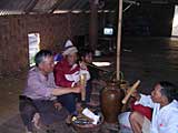 Ted samples some rice wine with the locals
