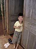 A Vietnamese boy enjoys his rice cake