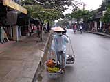 A local rubbish collector - you can see the mannequins in the tailors' shops on the left